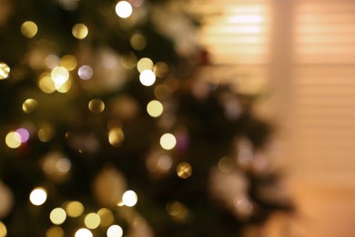 Photo of Blurred view of Christmas tree with fairy lights