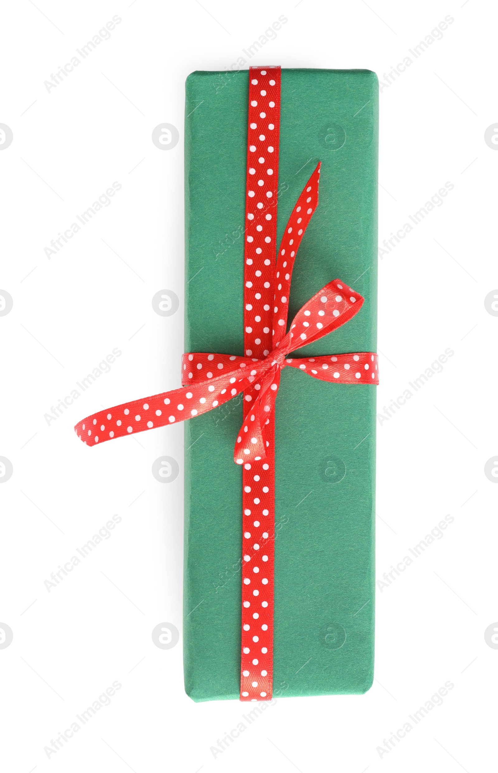 Photo of Christmas gift box decorated with red bow isolated on white, top view