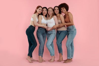 Photo of Group of beautiful young women on pink background
