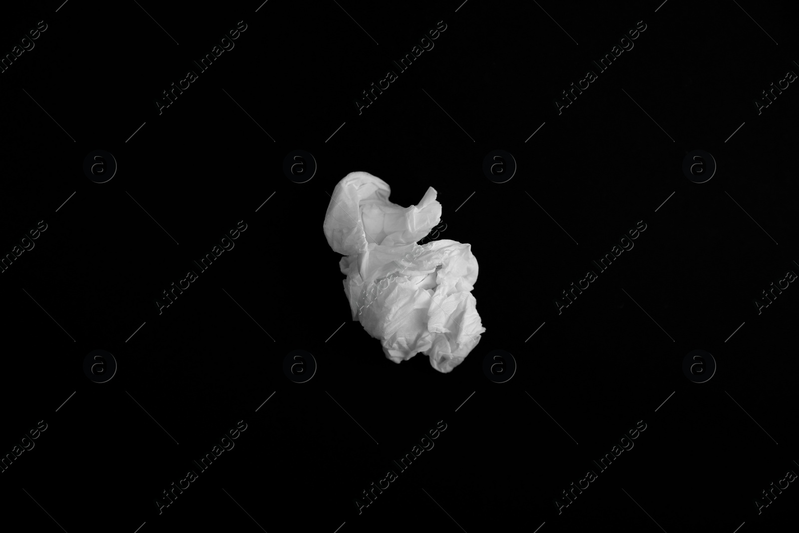 Photo of Used paper tissue on black background, top view