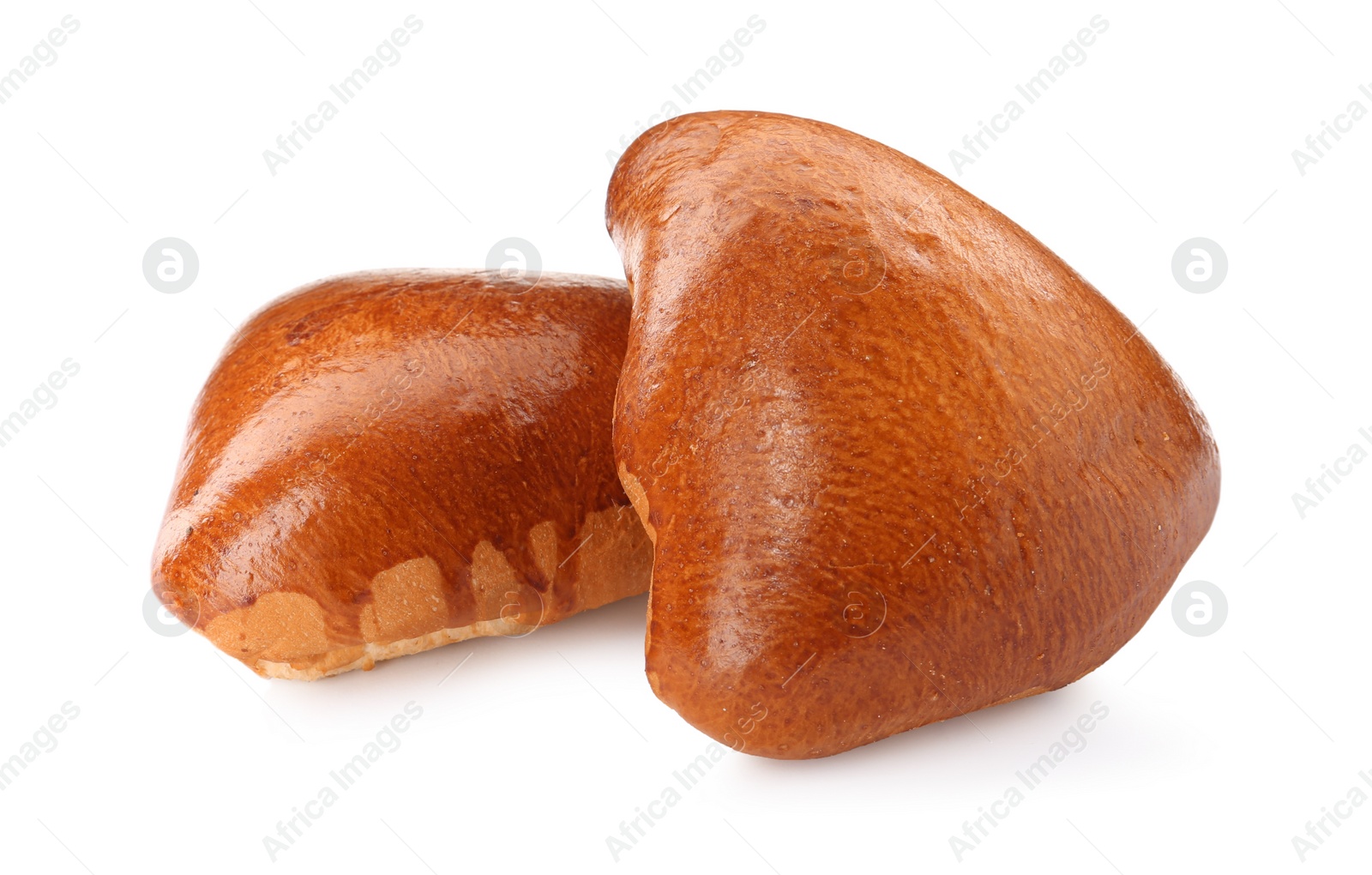 Photo of Two delicious baked patties on white background