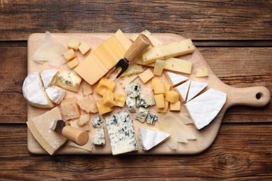 Photo of Cheese plate on wooden table, top view