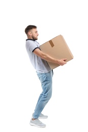 Photo of Full length portrait of young man carrying carton box on white background. Posture concept