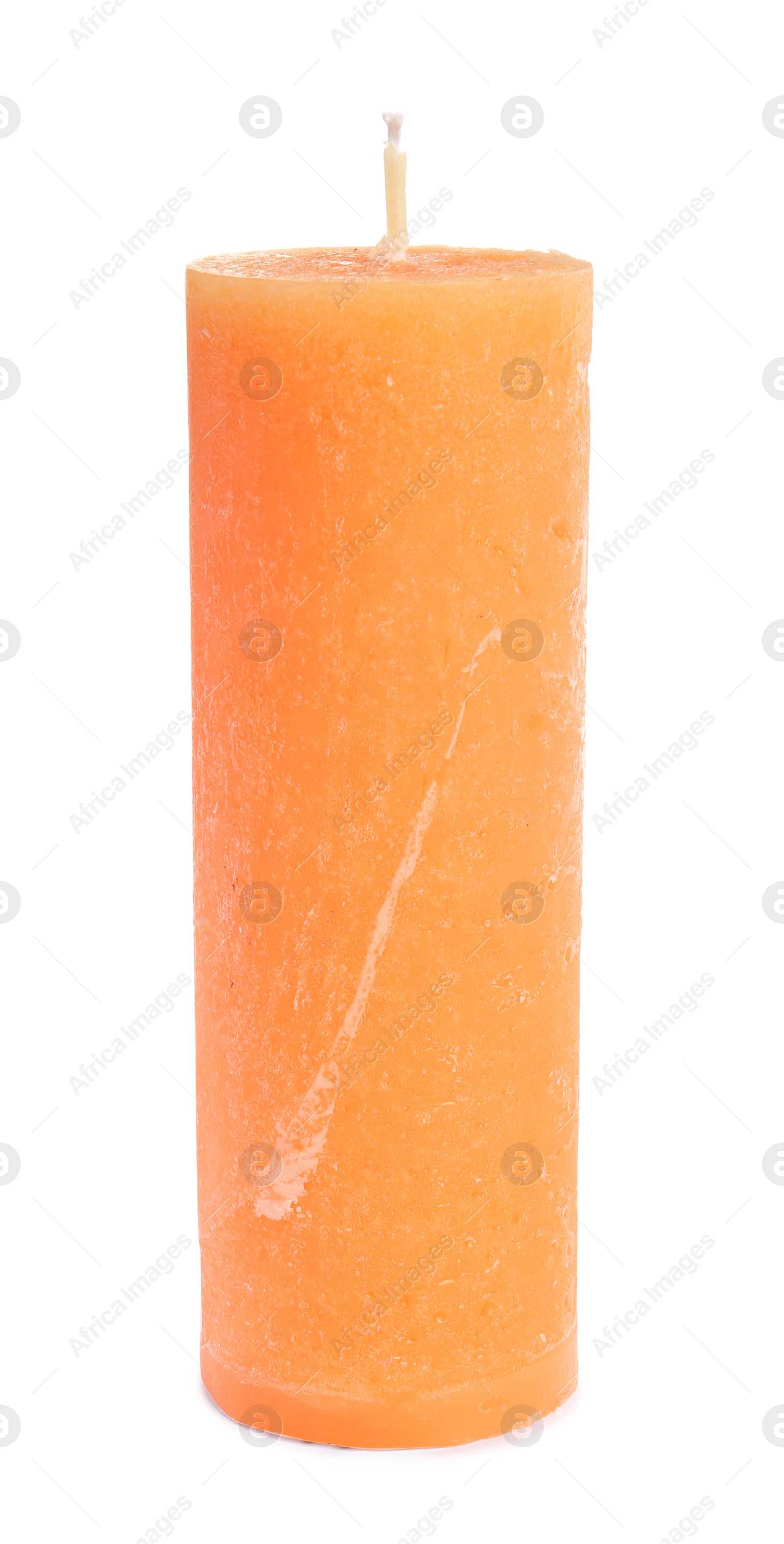 Photo of Decorative orange wax candle on white background