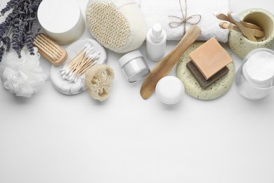 Bath accessories. Flat lay composition with personal care products on white background, space for text