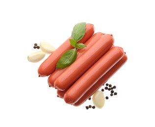 Photo of Fresh raw vegetarian sausages, basil and garlic on white background, top view