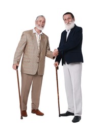 Photo of Senior men with walking canes shaking their hands on white background
