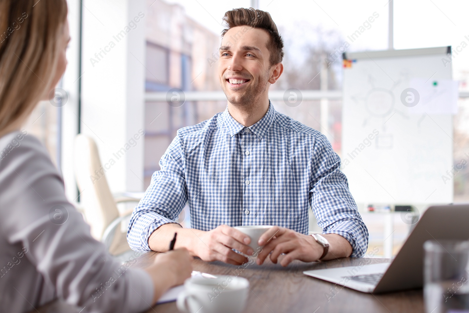 Photo of Human resources manager conducting job interview with applicant in office