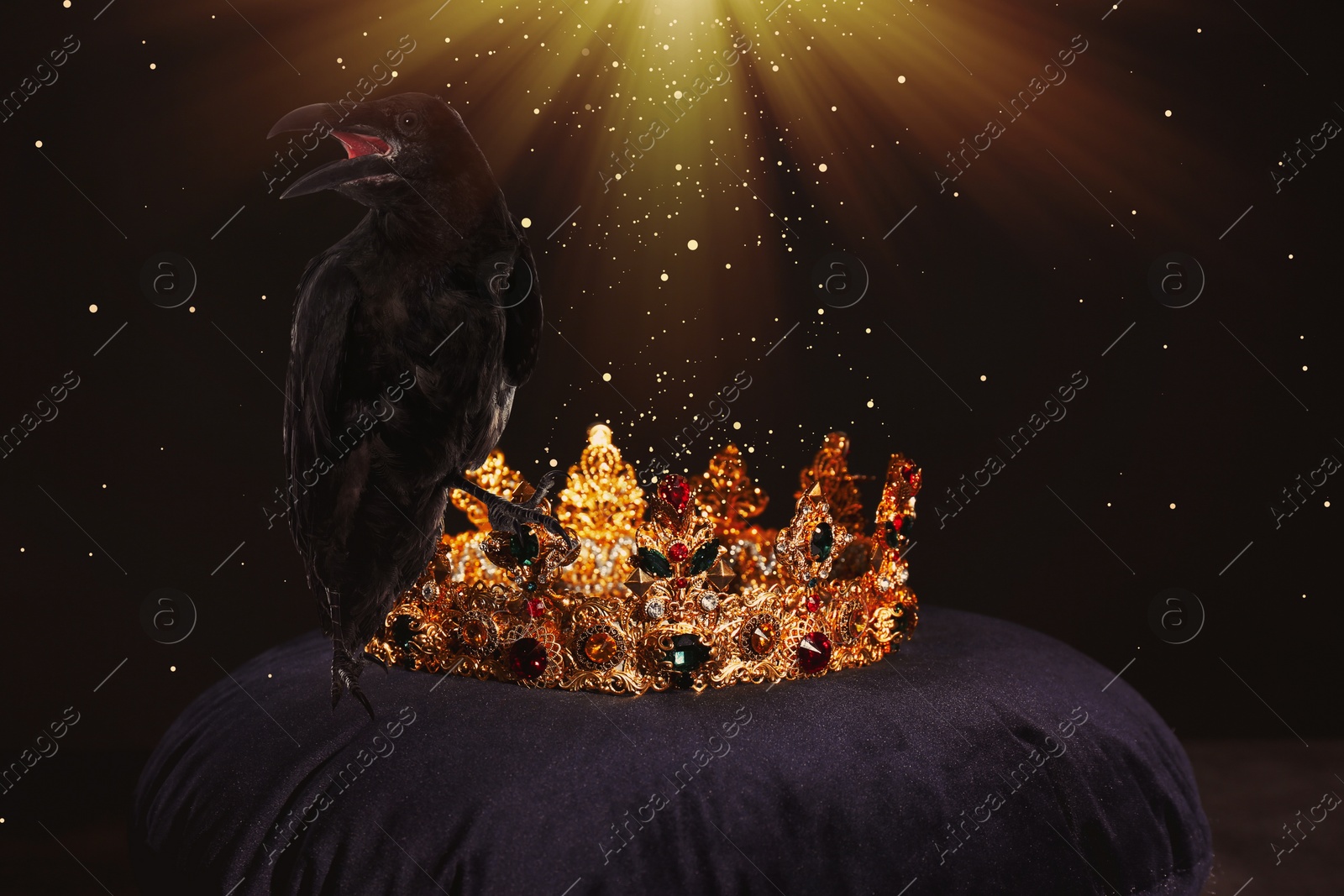 Image of Fantasy world. Black crow lit by magic light sitting on golden crown 