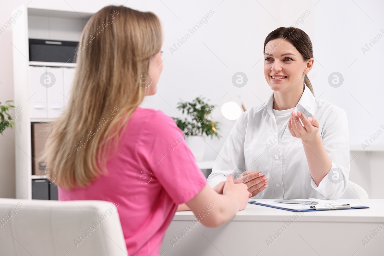 Photo of Mammologist consulting woman during appointment in hospital