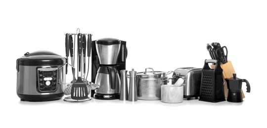Photo of Set of clean cookware, utensils and appliances isolated on white