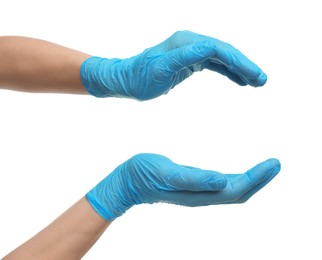 Doctor wearing light blue medical gloves holding something on white background, closeup