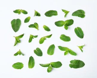 Flat lay composition with fresh green mint leaves on white background