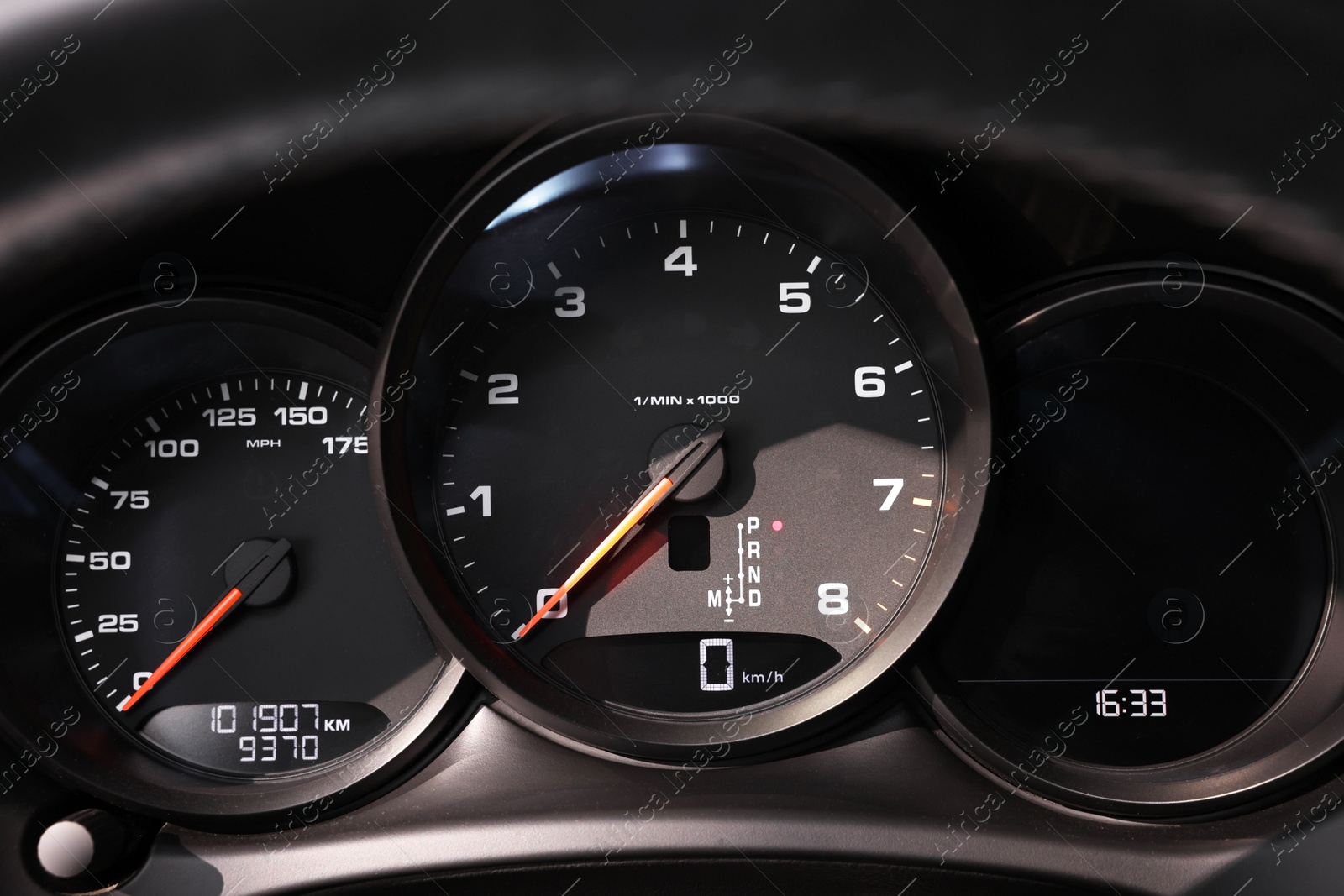 Photo of Speedometer and tachometer inside of modern car, closeup