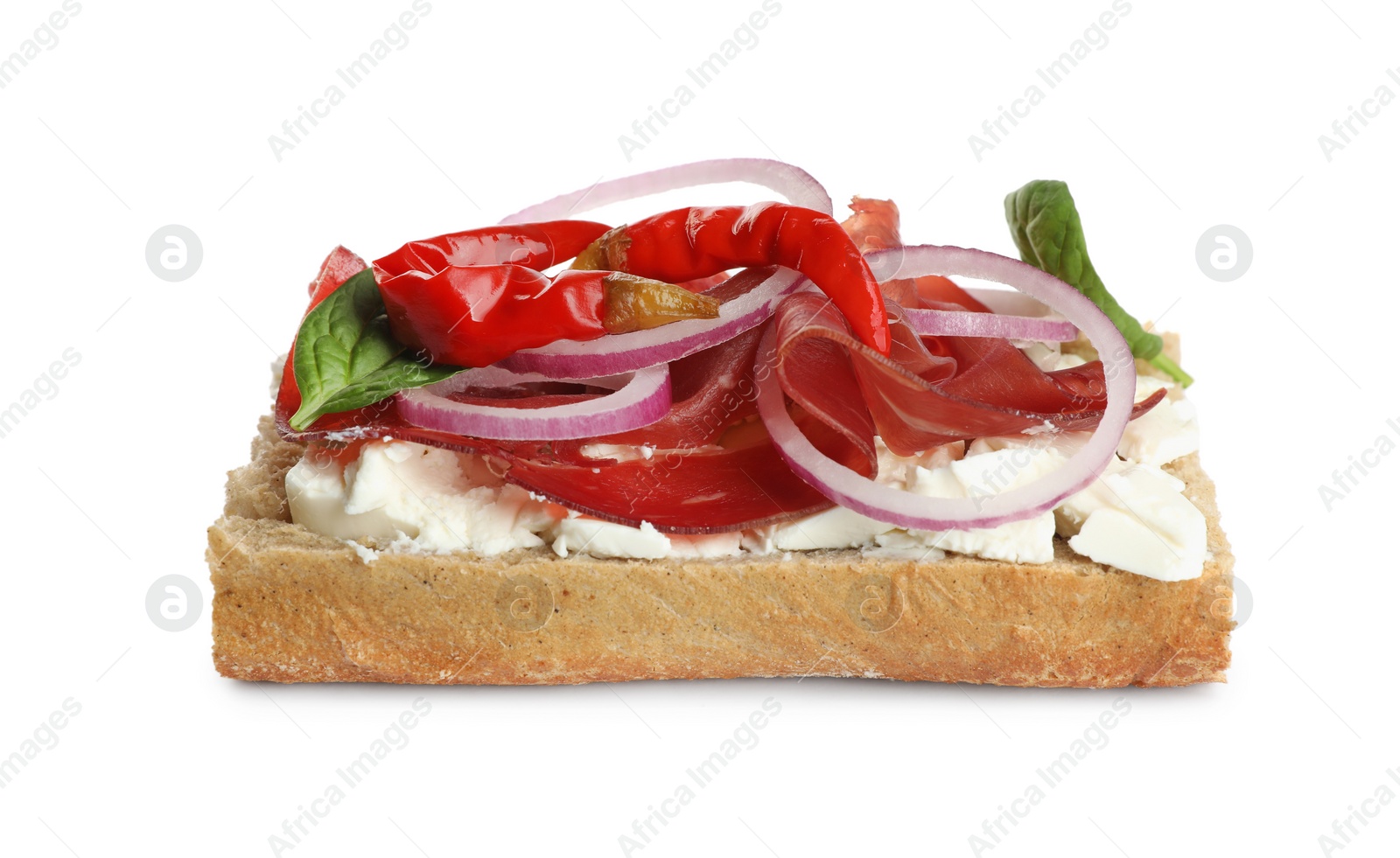 Photo of Delicious sandwich with bresaola, cream cheese, onion and chili pepper isolated on white