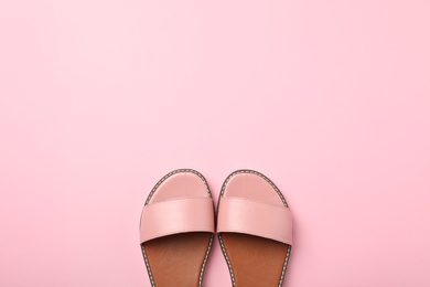 Photo of Pair of trendy women's shoes on color background, top view