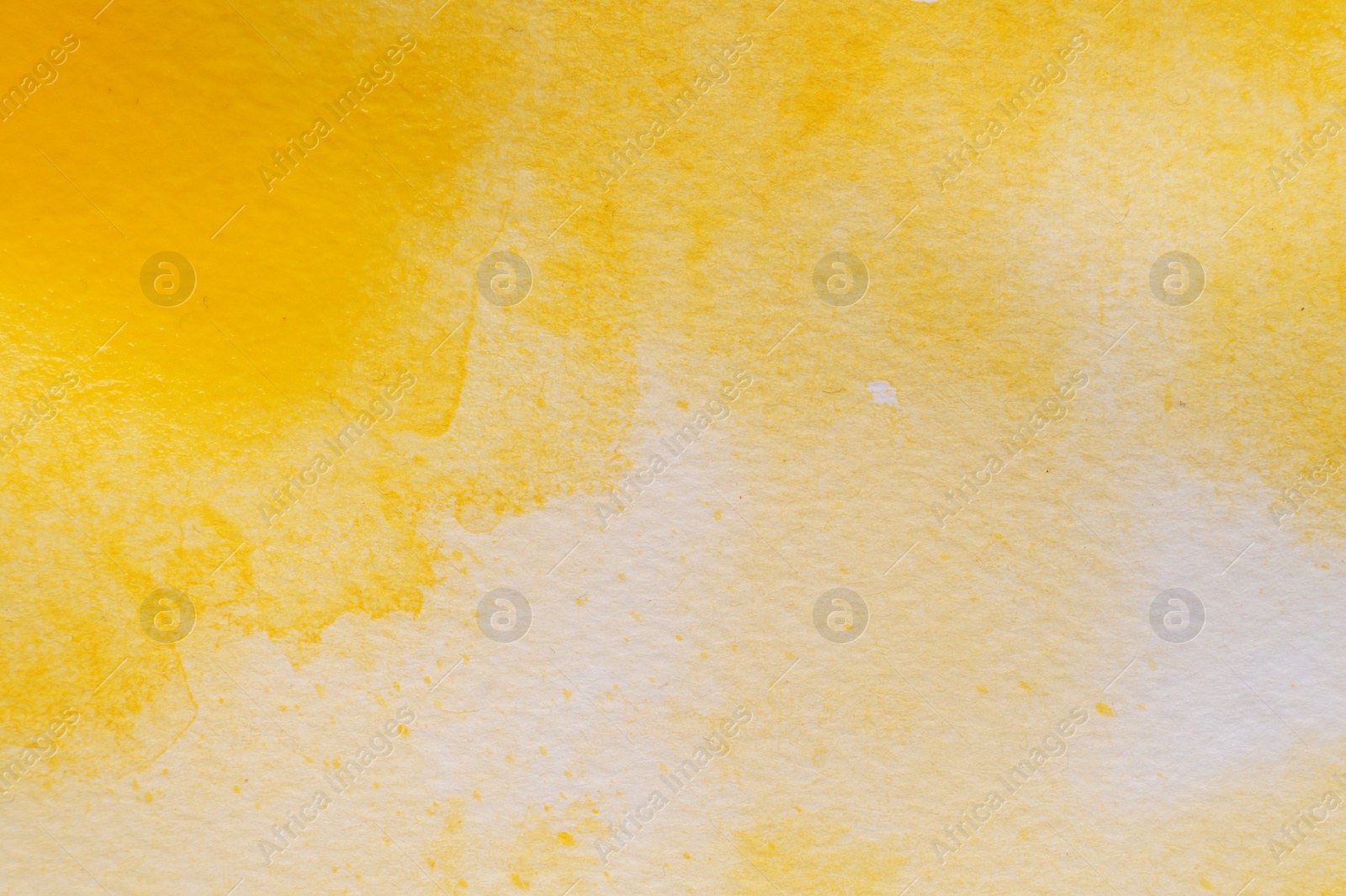 Photo of Abstract yellow watercolor painting as background, top view