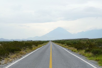 Photo of Beautiful view of empty asphalt highway outdoors. Road trip