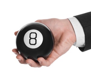 Man holding magic eight ball on white background, closeup