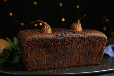 Photo of Tasty pear bread on slate board. Homemade cake