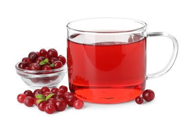 Photo of Cup of delicious cranberry tea and berries isolated on white