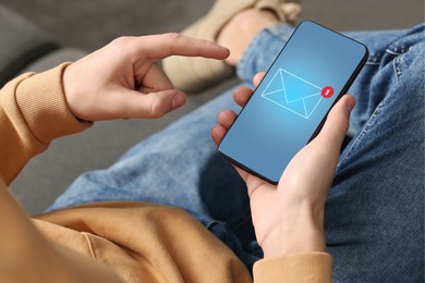 Man checking new message on mobile phone indoors, closeup