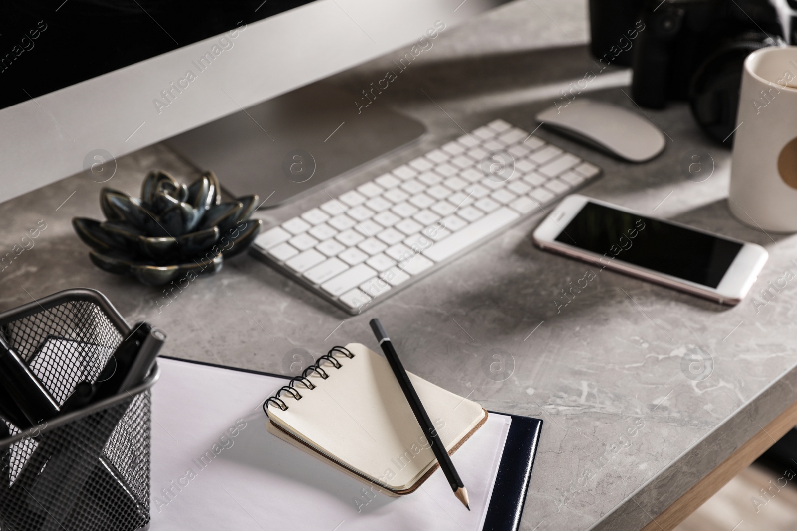 Photo of Designer's workplace with modern computer and stationery