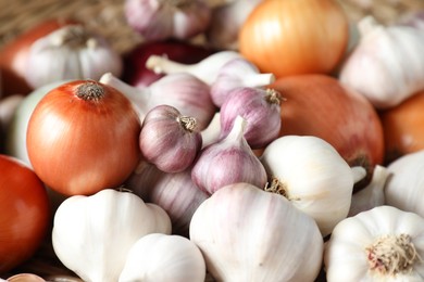 Fresh raw garlic and onions as background, closeup