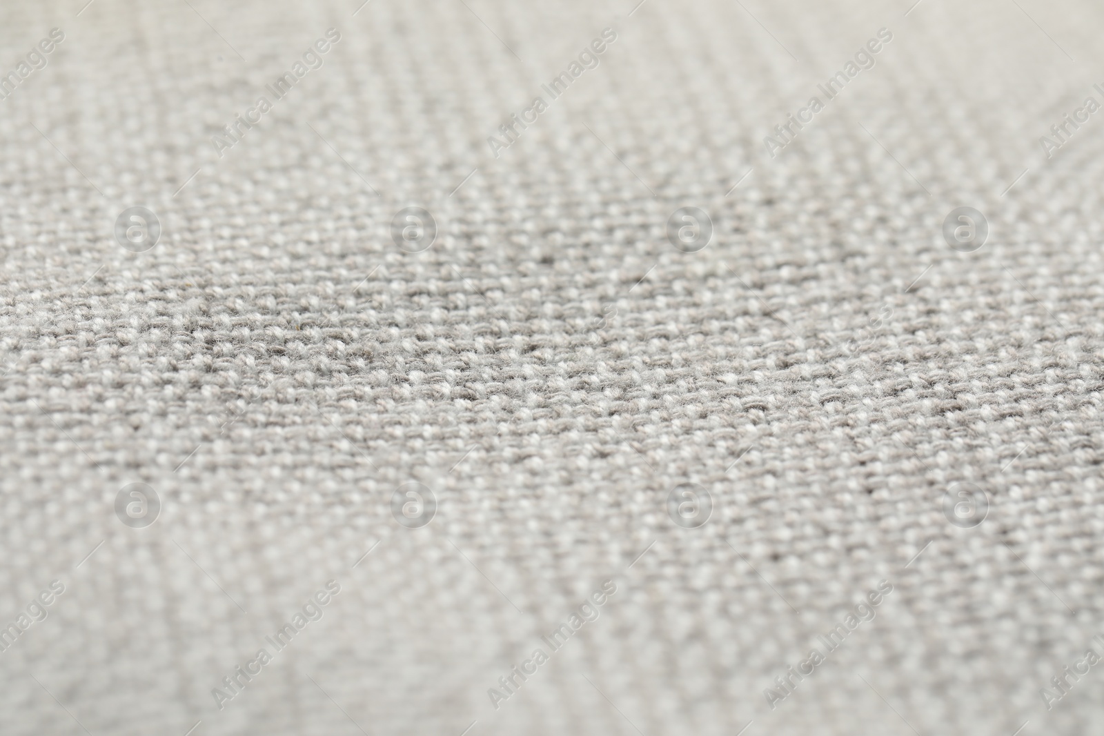 Photo of Texture of soft light grey fabric as background, closeup