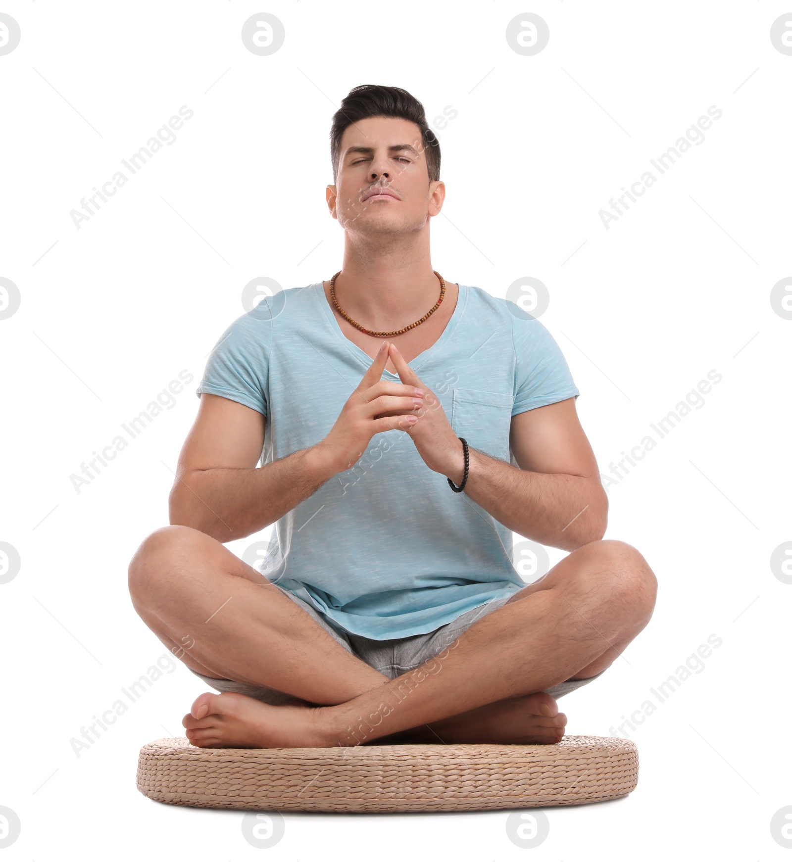 Photo of Man meditating on white background. Zen concept