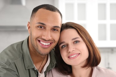 Photo of Dating agency. Portrait of happy couple in kitchen, closeup
