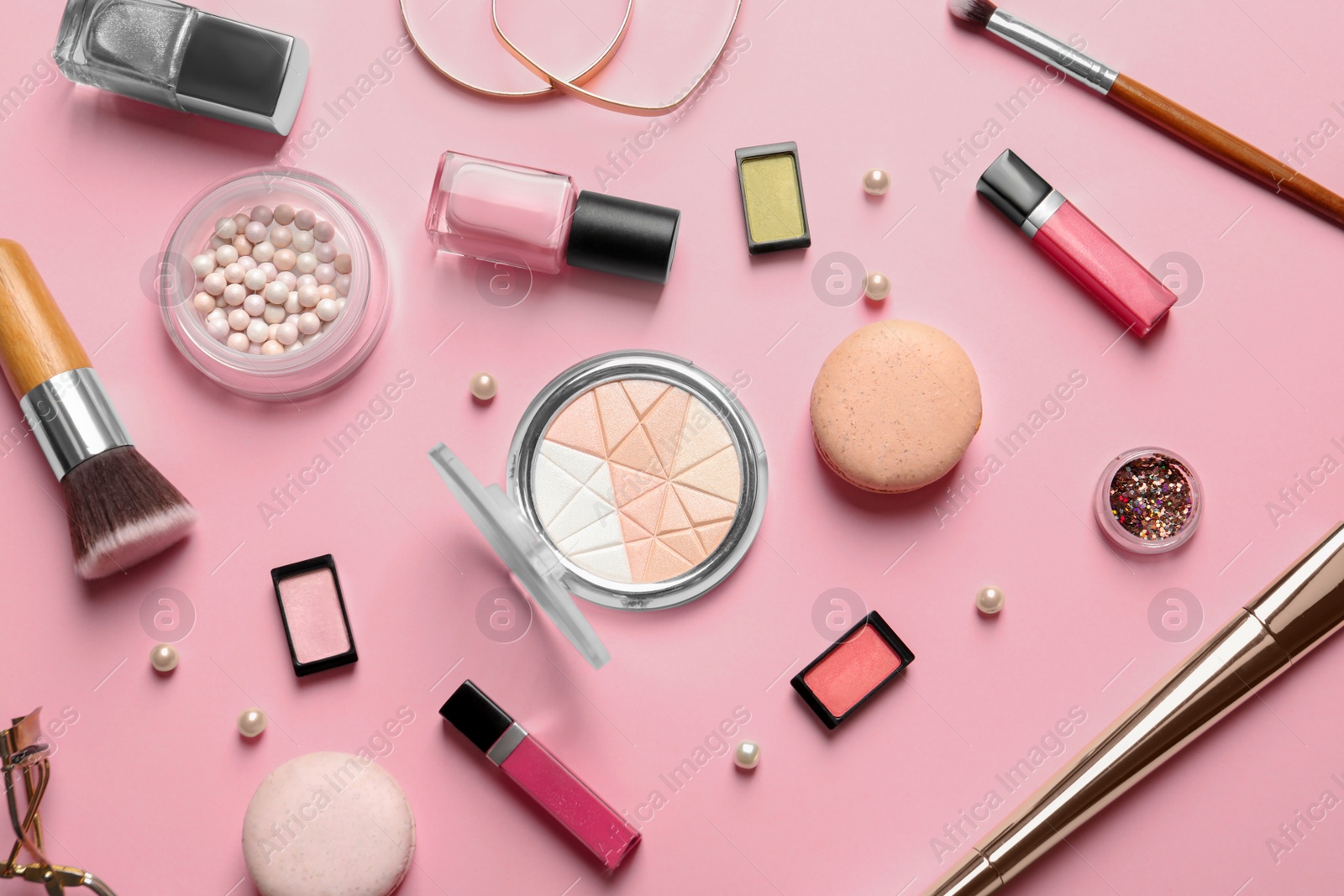 Photo of Decorative cosmetics and tools of professional makeup artist on color background