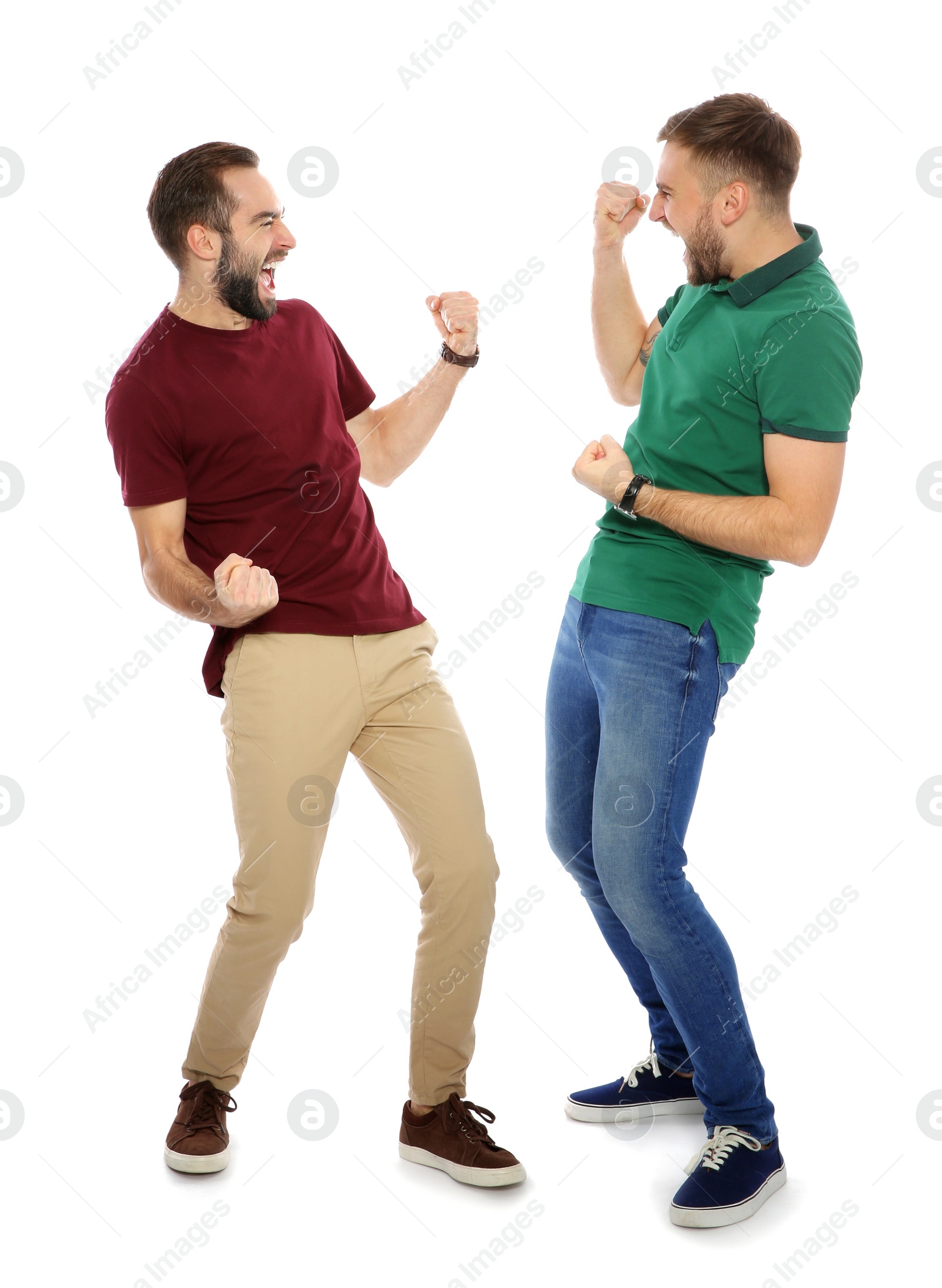 Photo of Young men celebrating victory on white background