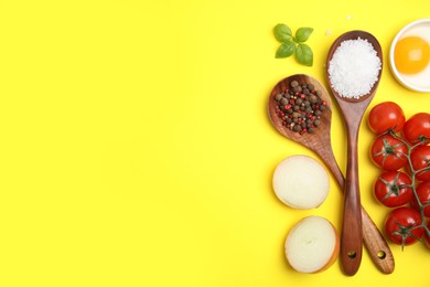 Photo of Flat lay composition with cooking utensils and fresh ingredients on yellow background. Space for text