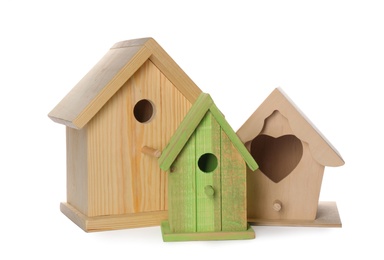 Three different bird houses on white background