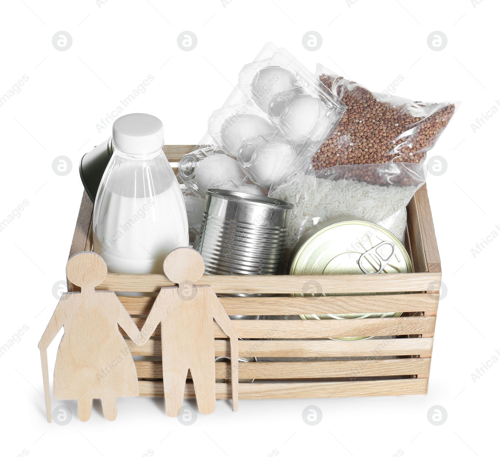 Photo of Humanitarian aid for elderly people. Donation box with food products and figure of senior couple isolated on white