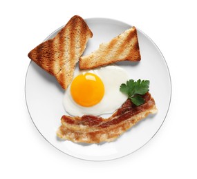 Tasty fried egg with toast and bacon in plate isolated on white, top view