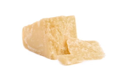 Photo of Pieces of delicious parmesan cheese on white background