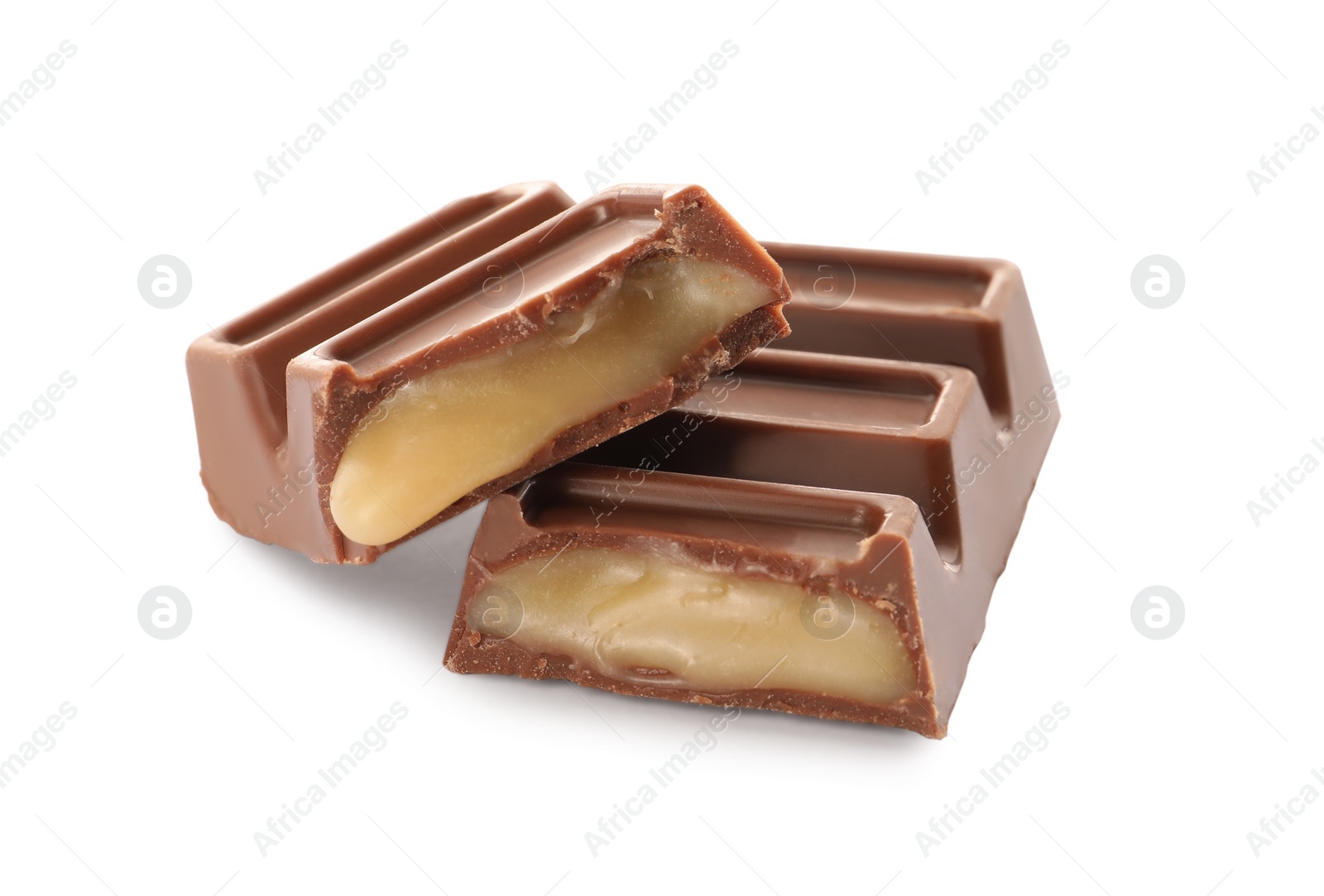 Photo of Pieces of delicious chocolate bar on white background