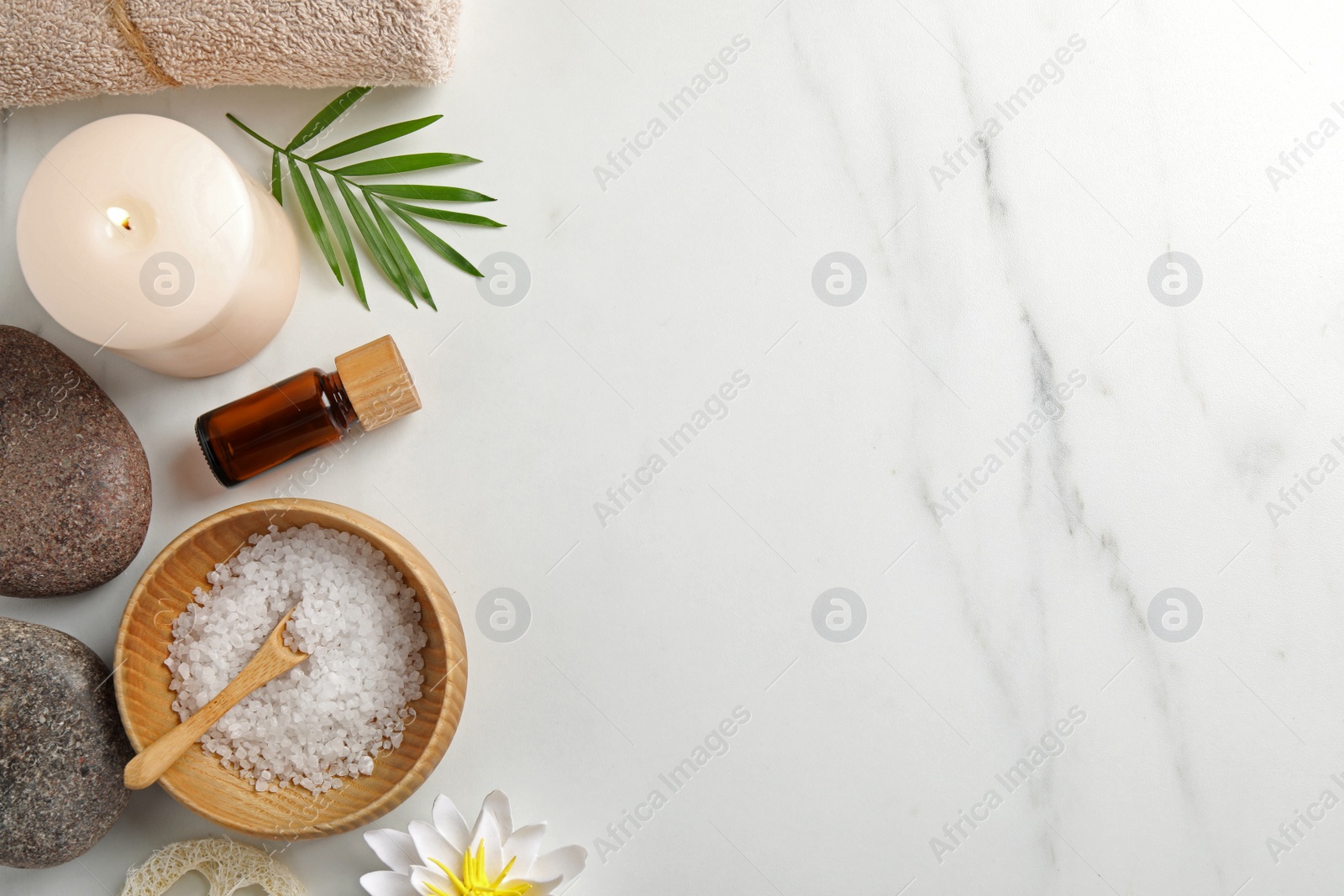 Photo of Flat lay composition with different spa products on white marble table. Space for text