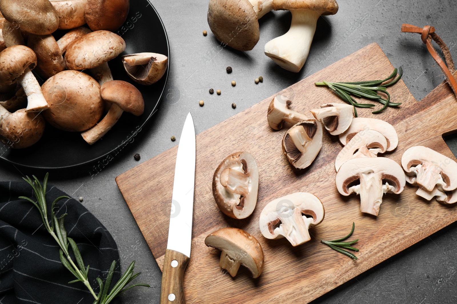 Photo of Flat lay composition with fresh wild mushrooms on grey table