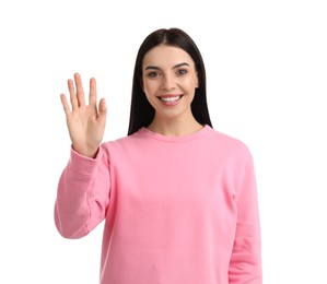 Photo of Attractive young woman showing hello gesture on white background