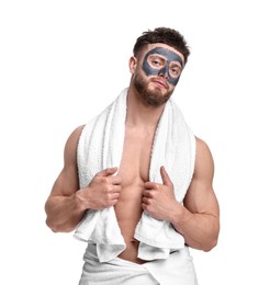 Handsome man with clay mask on his face against white background