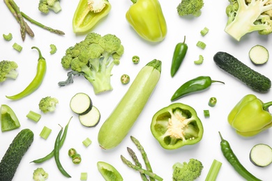 Flat lay composition with fresh vegetables on white background