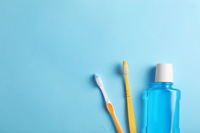 Photo of Flat lay composition with oral care products and space for text on color background. Teeth hygiene