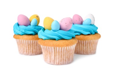 Photo of Tasty decorated Easter cupcakes isolated on white