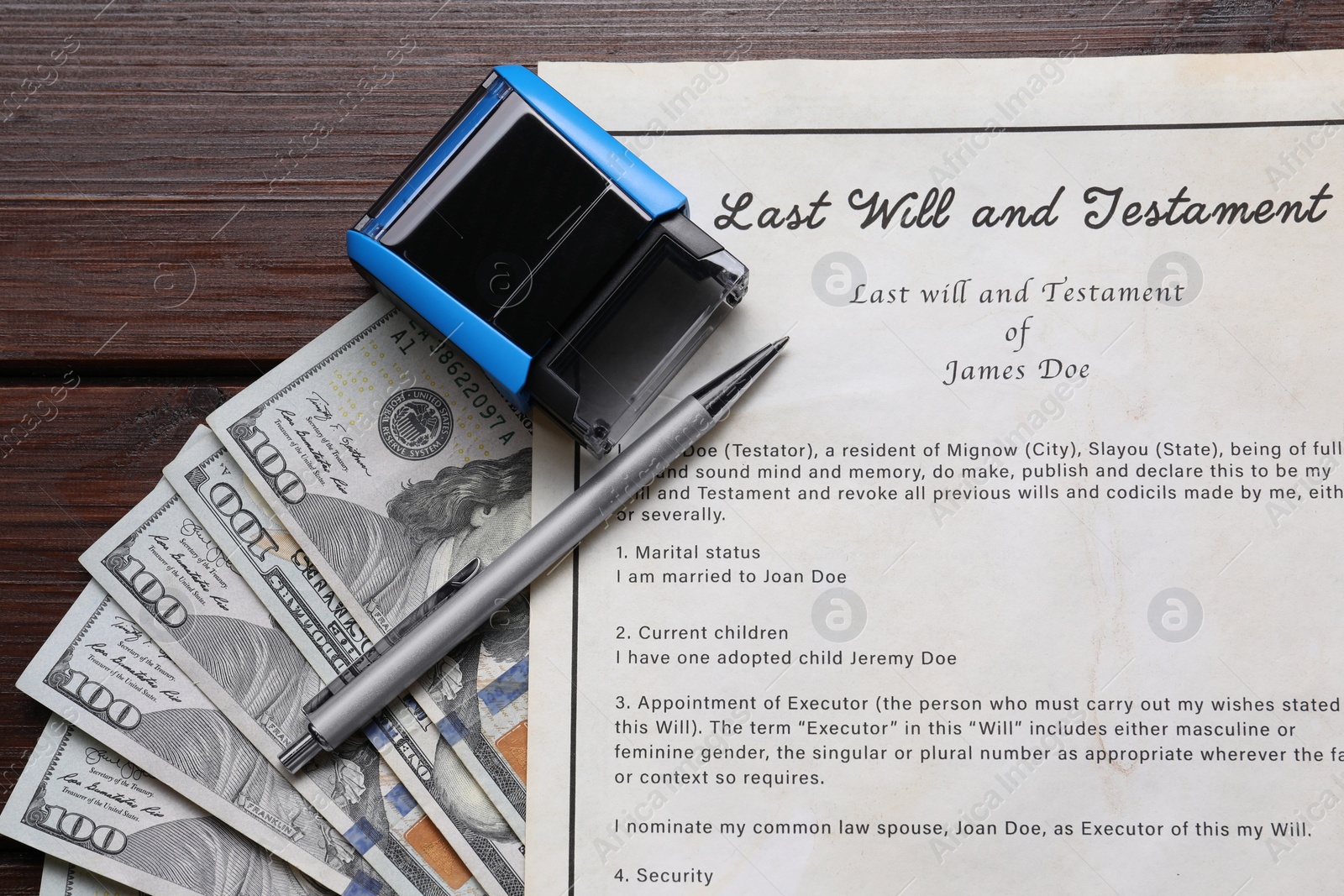 Photo of Last Will and Testament, stamp, dollar bills and pen on wooden table, flat lay