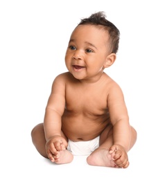 Adorable African-American baby in diaper on white background