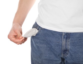 Photo of Poor man showing empty pocket on white background, closeup