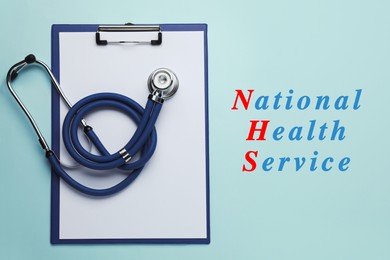 National health service (NHS). Stethoscope, clipboard and text on turquoise background, top view